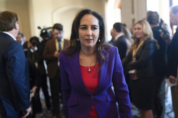Harmeet Dhillon walks through a hallway after talking to reporters at the Republican National Committee winter meeting in Dana Point, Calif., Jan. 27, 2023. (AP Photo/Jae C. Hong, File)