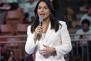 FILE - Democratic presidential candidate Rep. Tulsi Gabbard, D-Hawaii, speaks during the McIntyre-Shaheen 100 Club Dinner in Manchester, N.H. on Feb. 8, 2020. (AP Photo/Mary Altaffer, File)