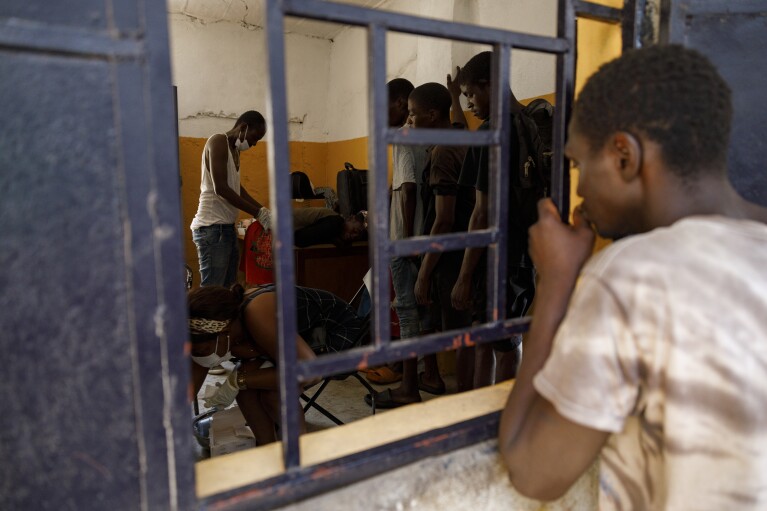 Kush users receive treatment at a medical outreach facility of Sierra Leone's Youth Development and Child Link (SLYDCL),an NGO that provides medical care and psychological needs for drug users, Friday, April 26, 2024. Sierra Leone declared a war on the cheap synthetic drug, calling it an epidemic and a national threat. The drug is ravaging youth, and healthcare services are severely limited. (AP Photo/ Misper Apawu)