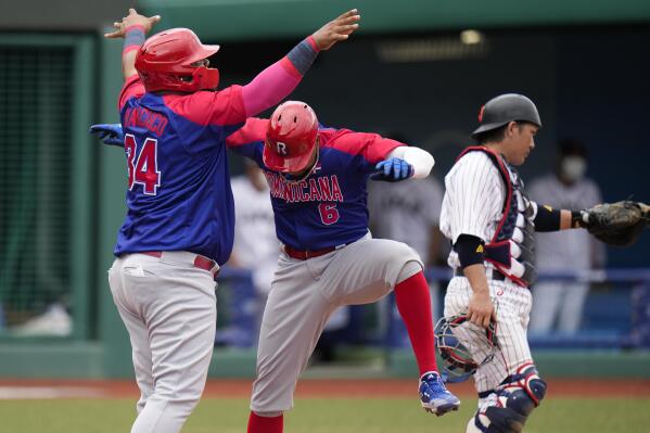 Baseball-Late rally lifts Japan over Dominican team to open Games' baseball  play