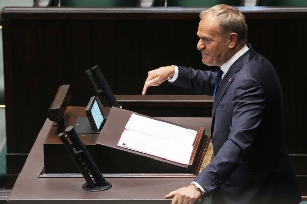Poland's Prime Minister Donald Tusk addresses the Polish parliament on Wednesday, June 11, 2025, in Warsaw, Poland. (AP Photo/Czarek Sokolowski)