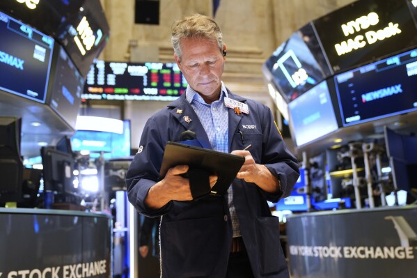 Bobby Charmak works on the floor at the New York Stock Exchange in New York, Thursday, April 3, 2025. (AP Photo/Seth Wenig)