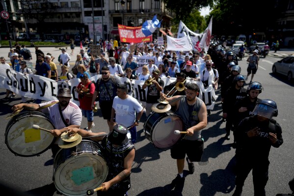 FILE- Public health workers protest against President Javier Milei's austerity measures that affect public health funding, in Buenos Aires, Argentina, Oct. 22, 2024. (AP Photo/Natacha Pisarenko, File)