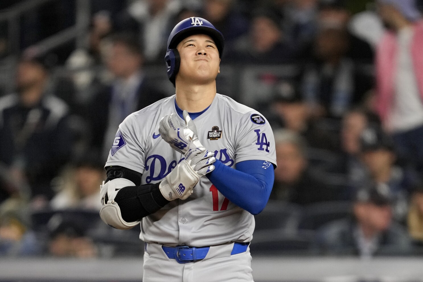 Shohei Ohtani returns after dislocating shoulder, goes hitless as Dodgers  take 3-0 World Series lead | AP News