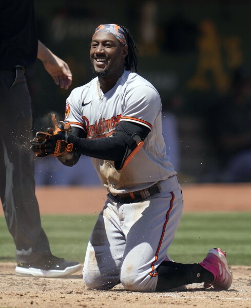 Baltimore Orioles' Jorge Mateo hits an inside-the-park home run during the  second inning of a baseball game against the Oakland Athletics in Oakland,  Calif., Sunday, Aug. 20, 2023. (AP Photo/Jeff Chiu Stock