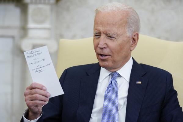 FILE - President Joe Biden holds notes as he meets with Indian Prime Minister Narendra Modi in the Oval Office of the White House, Sept. 24, 2021, in Washington. Biden is a man who writes down his thoughts. And some of those handwritten musings over his decades of public service are now a part of a special counsel's investigation into the handling of classified documents. It isn't clear yet what the investigators are looking for by taking the notes from his time as vice president and his years in the Senate, from his beach home in Rehoboth and his primary residence in Wilmington, Del. (AP Photo/Evan Vucci, File)