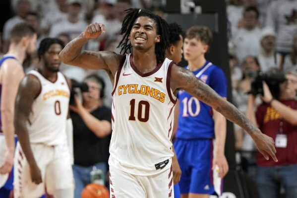 Iowa State guard Keshon Gilbert (10) celebrates a 79-75 win over Kansas after a NCAA college basketball game, Saturday, Jan. 27, 2024, in Ames, Iowa. (AP Photo/Matthew Putney)