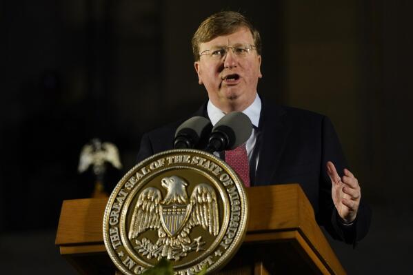 FILE - Republican Gov. Tate Reeves describes the state's economic progress during his State of the State address before a joint session of the Mississippi Legislature on the steps of the State Capitol in Jackson, Miss., on Jan. 30, 2023. Reeves did an abrupt about-face Sunday, Feb. 26, 2023, on an issue for which Democrats have been criticizing him this election year, saying for the first time that he wants the state to allow a full year of Medicaid coverage to women after they give birth. (AP Photo/Rogelio V. Solis, File)