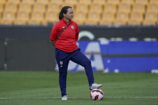 FILE -Twila Kilgore, assistant coach on the U.S. team watches players warm up prior to a CONCACAF Women's Championship soccer semifinal match against Costa Rica in Monterrey, Mexico, Thursday, July 14, 2022. Kilgore, is an assistant for the U.S. women’s national team and one of just four women in the United States who hold the U.S. Soccer Federation’s elite pro license.(AP Photo/Fernando Llano, File)