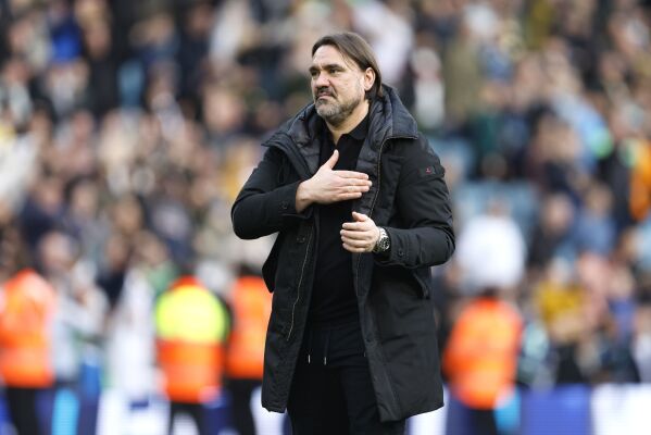Leeds United manager Daniel Farke gestures to the fans after the final whistle of the English Football Championship soccer match between Leeds United and Millwall, at Elland Road, in Leeds, England, Sunday March 17, 2024. Top of the table and heading toward promotion back to the English Premier League, the American owners of Leeds can feel happy with their offseason hire of coach Daniel Farke. Leeds went top of the second-tier Championship on Sunday, March 17, 2024 beating Millwall 2-0 and taking advantage of long-time leader Leicester’s FA Cup quarterfinals duty at Chelsea. (Richard Sellers/PA via AP)