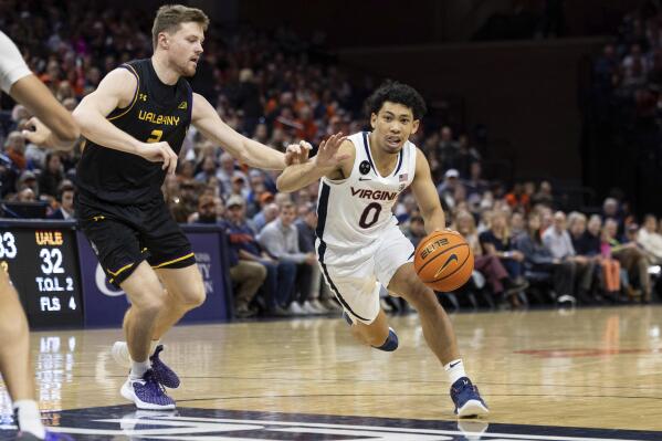 Virginia's Kihei Clark (0) drives with the ball against Albany's Trey Hutcheson during the second half of an NCAA college basketball game in Charlottesville, Va., Wednesday, Dec. 28, 2022. (AP Photo/Mike Kropf)