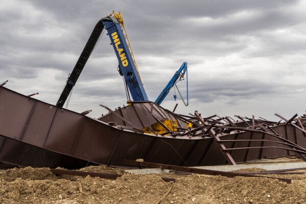 FILE - Twisted girders and debris cover the ground from a deadly structure collapse at a construction site near the Boise Airport that occurred the day before, Feb. 1, 2024, in Boise, Idaho. Workers had expressed concerns about bending or bowed beams and structural issues before the airport hangar under construction collapsed in January, killing three people and injuring nine others, the Idaho Statesman reported. (Darin Oswald/Idaho Statesman via AP, File)