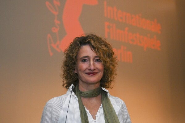 Tricia Tuttle is about to be introduced as the new director of the Berlinale at the Gropius Bau, in Berlin, Tuesday, Dec. 12, 2023. Tricia Tuttle, a former director of the London Film Festival, will become the new director of the Berlin International Film Festival next year, the German culture minister announced Tuesday. The 74th Berlin International Film Festival will take place from February 15 to 25, 2024. (Sebastian Christoph Gollnow/dpa via AP)
