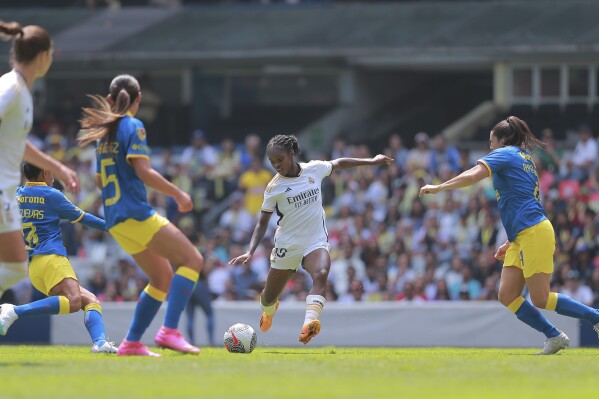 Linda Caicedo, center, of Spain's Real Madrid controls the ball during a women's friendly soccer match against Mexico's America at Azteca stadium in Mexico City, Sunday, Sept. 3, 2023. (AP Photo/Elizabeth Ruiz Ruiz)