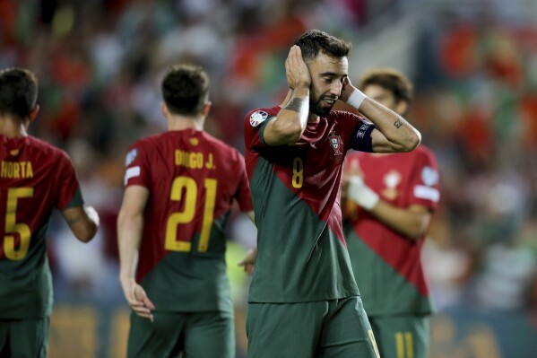 Portugal's Bruno Fernandes reacts after scoring his side's eighth goal during the Euro 2024 group J qualifying soccer match between Portugal and Luxembourg at the Algarve stadium outside Faro, Portugal, Monday, Sept. 11, 2023. (AP Photo/Joao Matos)