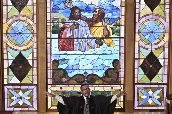 The Rev. Brandon Thomas Crowley speaks during Sunday service at Myrtle Baptist Church Sunday, May 5, 2024 in Newton, Mass. In 2015, Crowley, the senior pastor of the church, one of America's oldest Black churches, announced to his congregation, “I am a proud, Black, gay Christian male.” (AP Photo/Josh Reynolds)