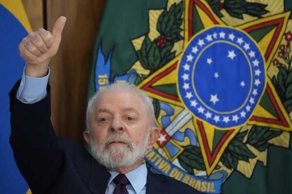 Brazil's President Luiz Inacio Lula da Silva gives a thumbs up sign during a breakfast with journalists at Planalto presidential palace in Brasilia, Brazil, Friday, Oct. 27, 2023, on his 78th birthday. (AP Photo/Eraldo Peres)