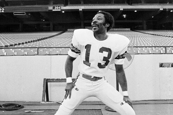 FILE - Cincinnati Bengals cornerback Ken Riley loosens up at the Pontiac Silverdome ahead of Super Bowl XVI against the San Francisco 49ers in Pontiac, Mich., Jan. 21, 1982. A former college quarterback who became one of the top cover cornerbacks of his era will inducted into the Hall four decades after his final game and three years after his death. (AP Photo/File)