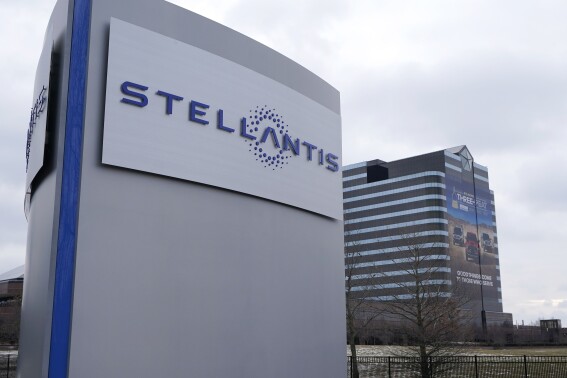 FILE - The Stellantis sign appears outside the Chrysler Technology Center in Auburn Hills, Mich, on Jan. 19, 2021. Automaker Stellantis announced a recall on Wednesday, Nov. 22, 2023, of more than 32,000 of its hybrid Jeep Wrangler SUVs because they pose a potential fire risk. Stellantis is advising people not to charge the affected SUVs or park them by buildings until they can be fixed. (AP Photo/Carlos Osorio, File)