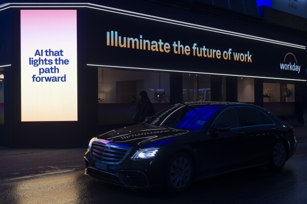 A display about AI is illuminated ahead of the Annual Meeting of the World Economy Form in the center of Davos, Switzerland