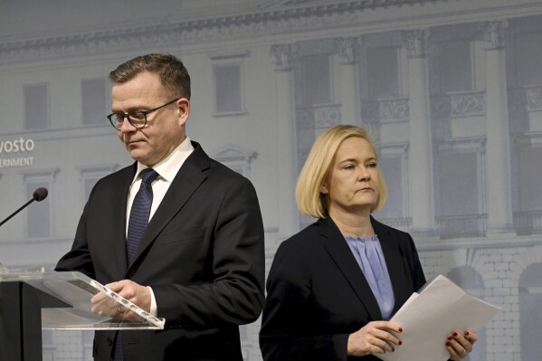 Finnish Prime Minister Petteri Orpo, left, and Interior Minister Mari Rantanen at a press conference in Helsinki, Finland on Tuesday, Dec. 12, 2023. Finland closed two weeks ago all checkpoints on border with Russia because of flow of third country migrants via Russia. (Markku Ulander/Lehtikuva via AP)