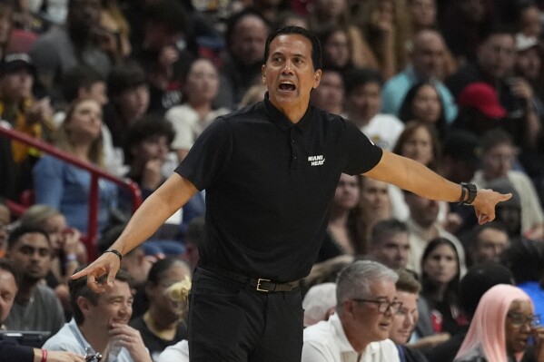 Miami Heat coach Erik Spoelstra gestures during the second half of an NBA basketball game against the Toronto Raptors, Friday, April 12, 2024, in Miami. (AP Photo/Marta Lavandier)