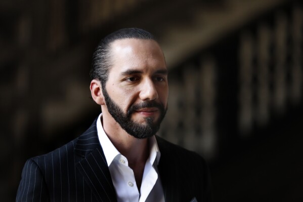 FILE - El Salvador's President Nayib Bukele speaks to the press at Mexico's National Palace after meeting with President Andres Manuel Lopez Obrador in Mexico City, March 12, 2019. Bukele is running for a second five-year term in 2024, despite a constitutional ban on reelection, largely on the results of his gang crackdown. (AP Photo/Marco Ugarte, File)