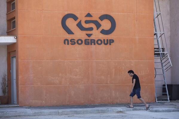 FILE - A logo adorns a wall on a branch of the Israeli tech company NSO Group, near the southern Israeli town of Sapir, Aug. 24, 2021. Digital-rights researchers have concluded that the mobile phones of four Jordanian human rights activists were hacked over a two-year period with software made by the Israeli spyware company NSO Group. Tuesday, April 5, 2022 findings by Front Line Defenders and Citizen Lab said at least some of the hackings appear to have been carried out by the Jordanian government. (AP Photo/Sebastian Scheiner, File)