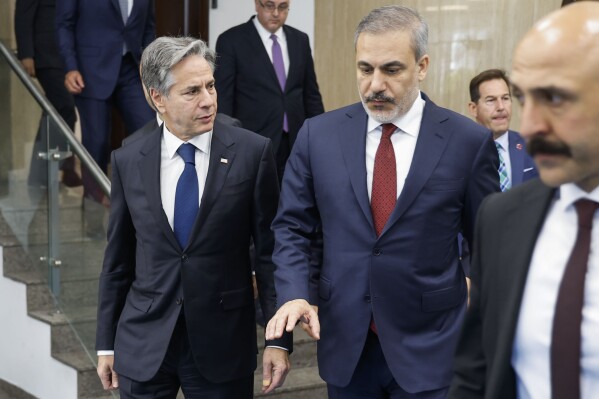 U.S. Secretary of State Antony Blinken, left, walks with Turkish Foreign Minister Hakan Fidan after a meeting at the Ministry of Foreign Affairs in Ankara, Turkey, Monday Nov. 6, 2023. Blinken was wrapping up a grueling Middle East diplomatic tour on Monday in Turkey after only limited success in his furious efforts to forge a regional consensus on how best to ease civilian suffering in Gaza as Israel intensifies its war against Hamas. (Jonathan Ernst/Pool via AP)
