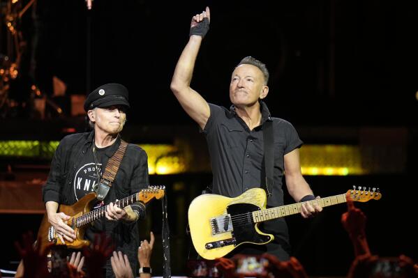 Singer Bruce Springsteen, right, and E Street Band member Nils Lofgren perform during their 2023 tour Wednesday, Feb. 1, 2023, at Amalie Arena in Tampa, Fla. (AP Photo/Chris O'Meara)