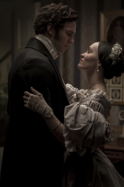 This imaged released by Focus Features shows Nicholas Hoult, left, and Lily-Rose Depp in a scene from "Nosferatu". (Focus Features via AP)