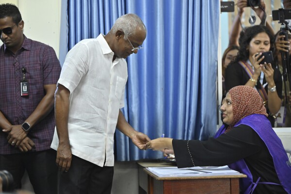 President of the Maldives Ibrahim Mohamed Solih Casts his vote at a polling station in Male, Maldives, Saturday, Sept. 9, 2023. Voting started in the Maldives presidential election Saturday, a virtual referendum over which regional power India or China will have the biggest influence in the Indian Ocean archipelago state. (Mohamed Sharuhaan )