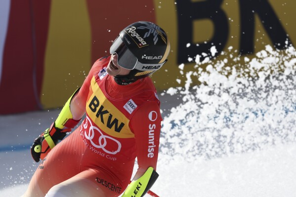 Switzerland's Lara Gut Behrami gets to the finish area after completing an alpine ski, women's World Cup super-G, in Crans Montana, Switzerland, Sunday, Feb. 18, 2024. (AP Photo/Marco Trovati)