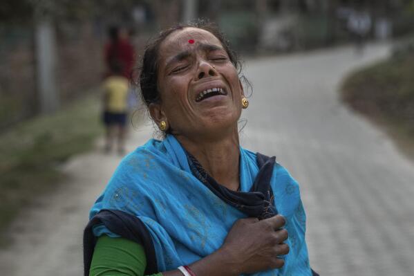 Radha Rani Mondal, 50, wails after her son was arrested by police in Morigaon district of Indian northeastern state of Assam, Friday, Feb. 10, 2023. Mondal's 20-year-old son was arrested on 4 February and her 17-year-old daughter-in-law is pregnant. She spent her last 500 rupees ($6 ) to hire a lawyer, whom she owes 20,000 rupees ($ 250 ) more. More than 3,000 men, including Hindu and Muslim priests, who were arrested nearly two weeks ago in the northeastern state of Assam under a wide crackdown on illegal child marriages involving girls under the age of 18. (AP Photo/Anupam Nath)