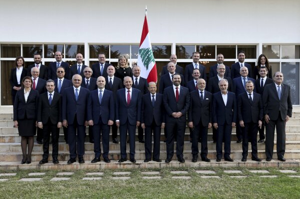 
              In this photo released by the Lebanese Government, members of Lebanon's new government, pose for an official picture at the Presidential Palace in Baabda, east of Beirut, Lebanon, Saturday, Feb. 2, 2019. The new Cabinet was announced Thursday night breaking a nine-month deadlock that had deepened Lebanon's economic woes. (Dalati Nohra/Lebanese Government via AP)
            