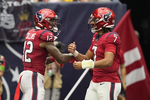 Houston Texans wide receiver Nico Collins (12) and quarterback C.J. Stroud (7) celebrate after they connected for a touchdown during the second half of an NFL football game against the Pittsburgh Steelers, Sunday, Oct. 1, 2023, in Houston. (AP Photo/David J. Phillip)