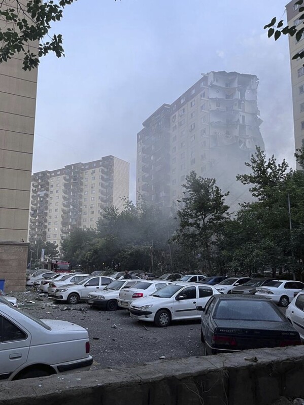 Smoke rises from a damaged building in Tehran, Iran, early Friday, June 13, 2025. Israel attacked Iran's capital early Friday, with explosions booming across Tehran. (AP Photo)
