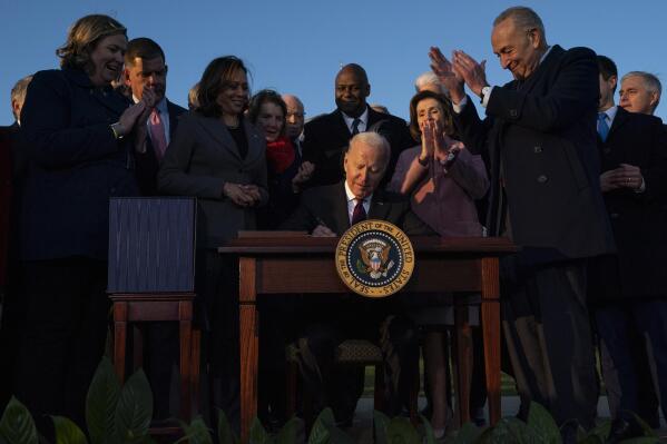 FILE - President Joe Biden signs the "Infrastructure Investment and Jobs Act" during an event on the South Lawn of the White House, Nov. 15, 2021, in Washington. Biden will deliver his State of the Union address to a joint session of Congress on Tuesday, March 1, 2022. (AP Photo/Evan Vucci, File)