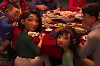 This image released by Netflix shows animated characters, from left, Chin, voiced by Robert G. Chiu, Mrs. Zhong, voiced by Sandra Oh, Fei Fei, voiced by Cathy Ang and Father, voiced by John Cho in a scene from "Over the Moon." (Netflix via AP)