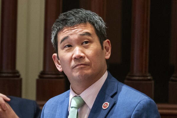 FILE - State Sen. Dave Min, D-Irvine, listens as lawmakers discuss a bill before the Senate at the Capitol in Sacramento, Calif., Monday, July 10, 2023. A federal judge has blocked California’s ban on gun shows at county fairs, ruling that the state is violating the rights of sellers and would-be buyers by prohibiting transactions for firearms that can be bought at any gun shop. The decision, Monday, Oct. 30, by U.S. District Judge Mark Holcomb halts enforcement of two state laws, both written by Min, who called Holcomb’s injunction “shocking,” and predicted it would be overturned on appeal. (AP Photo/Rich Pedroncelli, File)