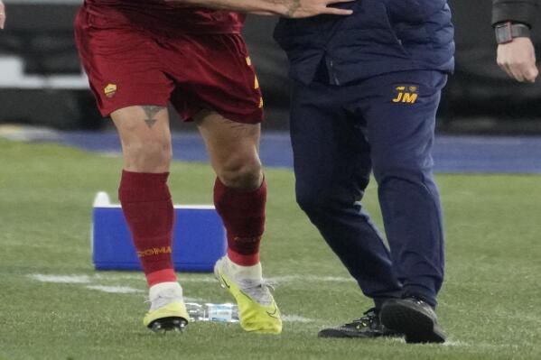 Roma's Lorenzo Pellegrini, left, celebrates with Roma's head coach Jose Mourinho after scoring his side's second goal during the Serie A soccer match between Roma and Udinese at Rome's Olympic Stadium, Sunday, April 16, 2023. (AP Photo/Andrew Medichini)