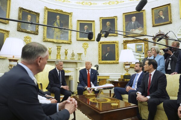 President Donald Trump meets Canadian Prime Minister Mark Carney in the Oval Office of the White House, Tuesday, May 6, 2025, in Washington. (AP Photo/Evan Vucci)