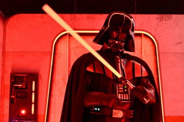 A Darth Vader costumed character poses at the Hasbro and Amazon Star Wars interactive Imperial March experience at the Empire State Building on Thursday, March 21, 2024, in New York. (Photo by Evan Agostini/Invision/AP, file)