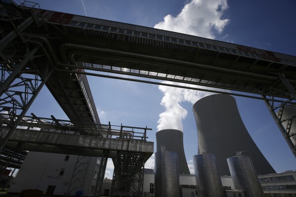 FILE - Equipment frames the cooling towers of the Temelin nuclear power plant near the town of Tyn nad Vltavou, Czech Republic, on Thursday, June 25, 2015. The U.S. and its European allies are importing vast amounts of nuclear fuel and compounds from Russia, providing Moscow with hundreds of millions of dollars in badly needed revenue as it wages war on Ukraine. (AP Photo/Petr David Josek, File)