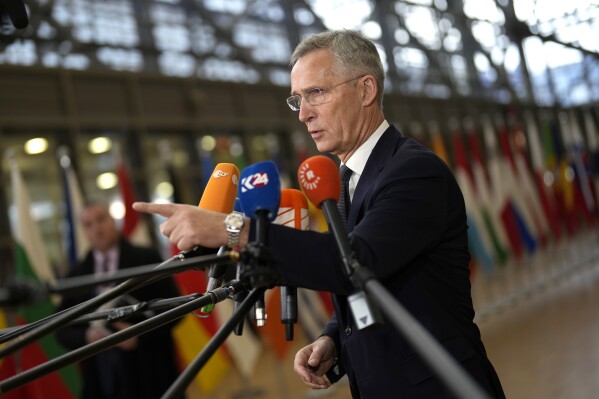 NATO Secretary General Jens Stoltenberg speaks with the media as he arrives for a meeting of EU foreign and defense ministers at the European Council building in Brussels, Tuesday, Nov. 14, 2023. European Union nations on Tuesday acknowledged that they are well on their way to failing Ukraine when it comes to providing their promised part of ammunition that Kyiv so dearly needs to stave off the Russian invasion and win back its territory. (AP Photo/Virginia Mayo)