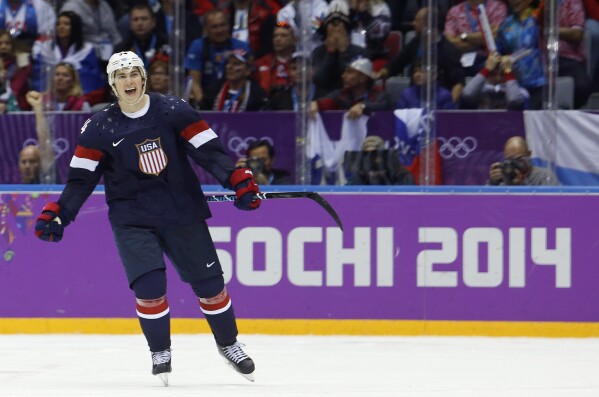 USA forward TJ Oshie celebrates scoring the winning shootout goal against Russia at the 2014 Winter Olympics. (AP Photos/Mark Humphrey, Files)