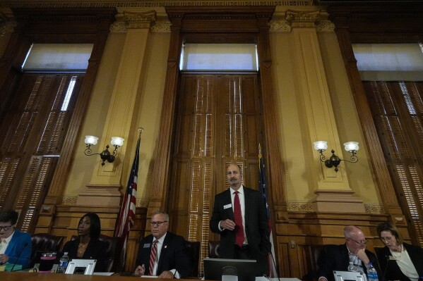 Georgia's State Election Board members discuss proposals for election rule changes at the state capitol, Friday, Sept. 20, 2024, in Atlanta. (AP Photo/Mike Stewart, File)