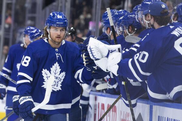 Toronto Maple Leafs' William Nylander is congratulated for his goal against the Tampa Bay Lightning during the first period of an NHL hockey game Thursday, Dec. 9, 2021, in Toronto. (Chris Young/The Canadian Press via AP)