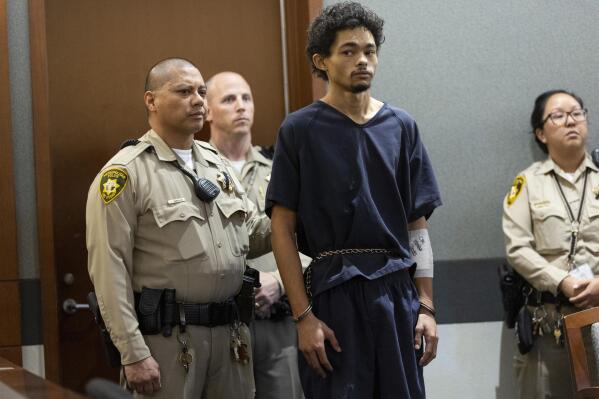 Tyson Hampton, accused of shooting and killing a Las Vegas police officer, appears for a court hearing at the Regional Justice Center in Las Vegas, Tuesday, Oct. 18, 2022. (Erik Verduzco/Las Vegas Review-Journal via AP)