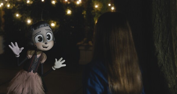 This image released by Paramount Pictures shows the character Blossom, voiced by Phoebe Waller-Bridge, left, and Cailey Fleming in a scene from "IF." (Paramount Pictures via AP)
